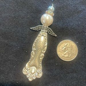 Handmade ornate silver angel pendant/ornament.